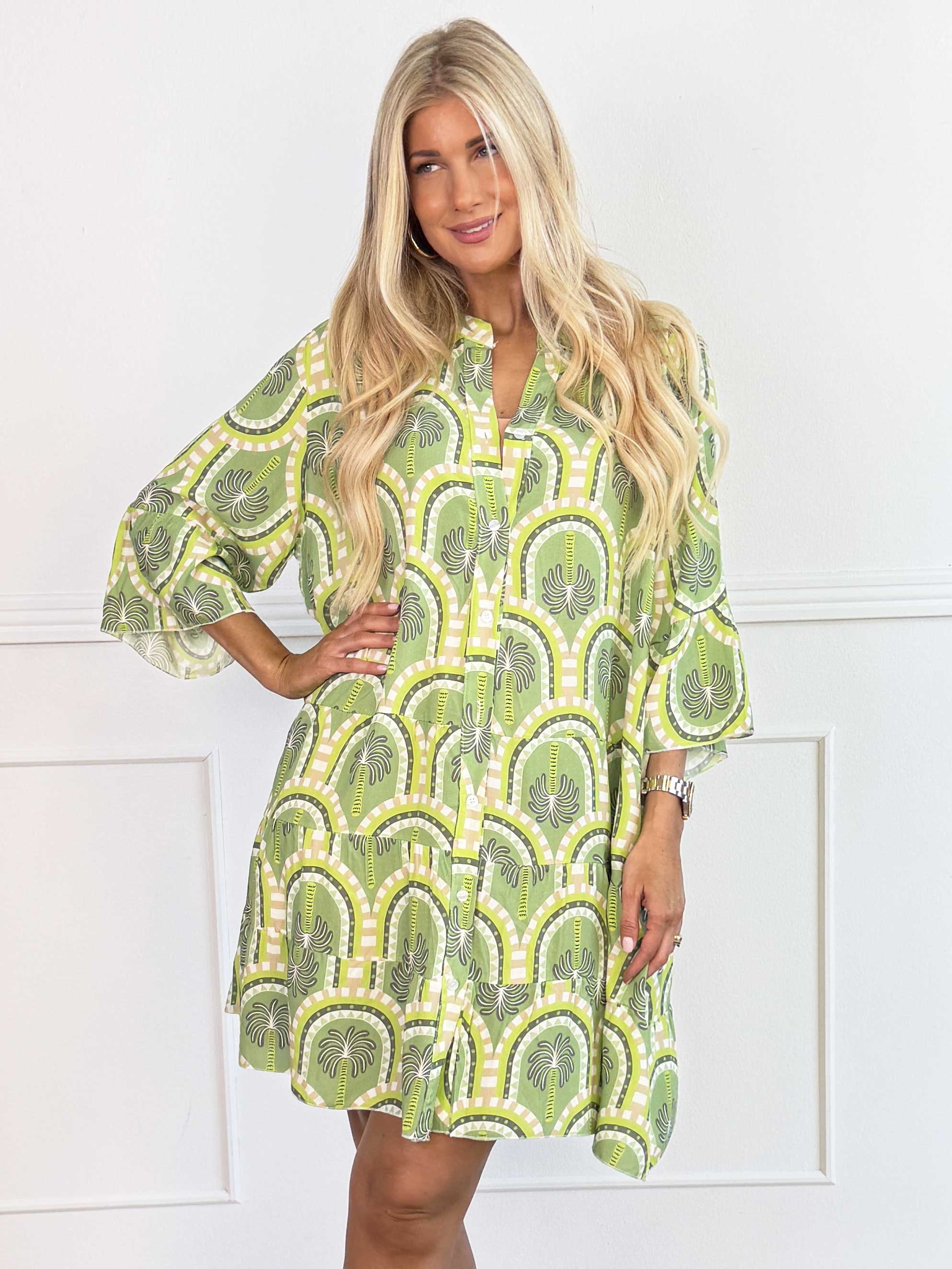 Severina - Plus size tunikakjole i viskose med palmemotiver og flæsekant forneden